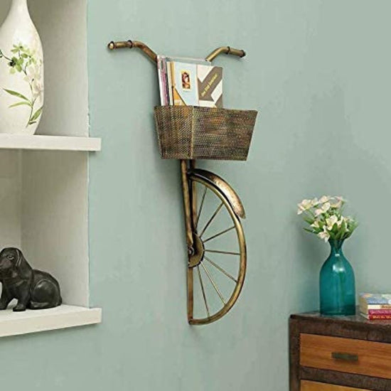 Enhance your living room with this stylish Big Cycle Basket Metal Wall Art. This elegant wall art is crafted from sturdy metal and measures 18 x 27 inches. Perfect for any home, it will add beauty and style to any wall. Made of High-Quality Iron Metal Anti-Rust Powder Coating used for long lasting finish and durability Hanging mechanism Included Perfect for your living room, bedroom, hall, office reception, guest room, and hotel reception