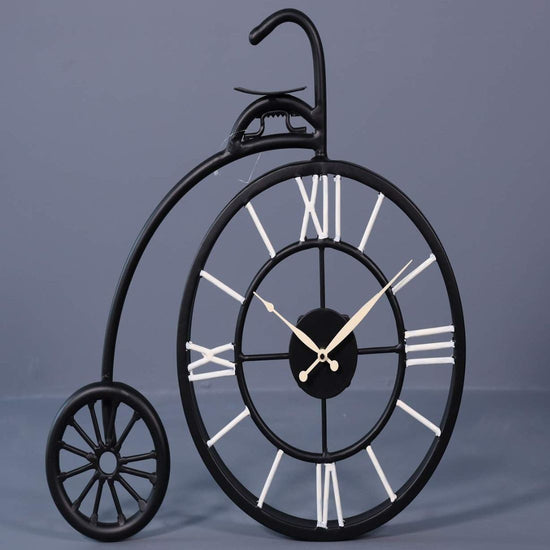 This Vintage Wheel Metal Wall Clock is the perfect addition to any living room. Crafted with durable metal, it features a vintage wheel design that adds a touch of unique charm to any space. Keep track of time in style while adding a touch of retro appeal to your home decor.